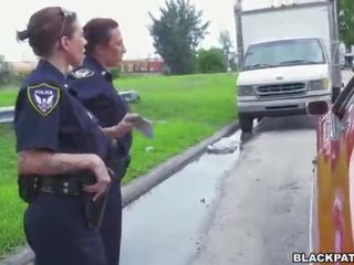 Female cops pull over black suspect and suck his cock